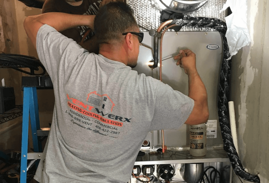 HVAC contractor fixing home furnace